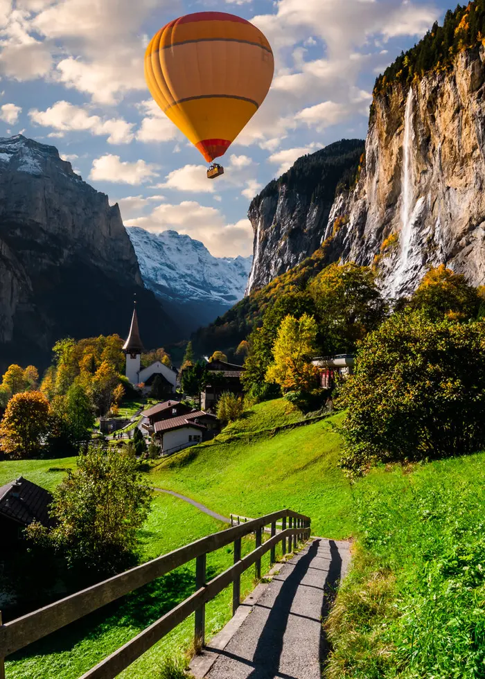 Hot-air balloon above an Alpine landscape