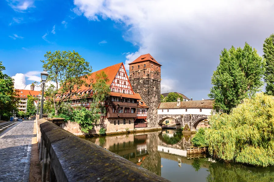 Medieval buildings and a stone bridge over the Pegnitz in Nuremberg