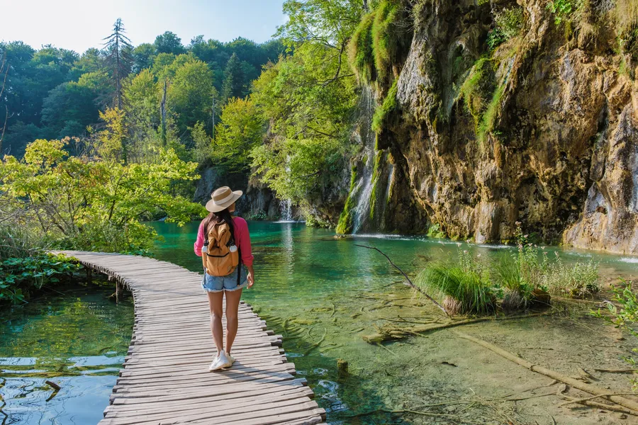 Wooden walkway through the waterfalls of Plitvice Lakes