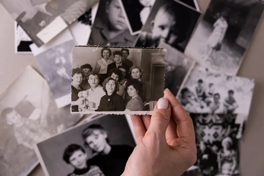 Printed vintage photographs laid out on a table